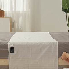 Place the bedsheet across the bed