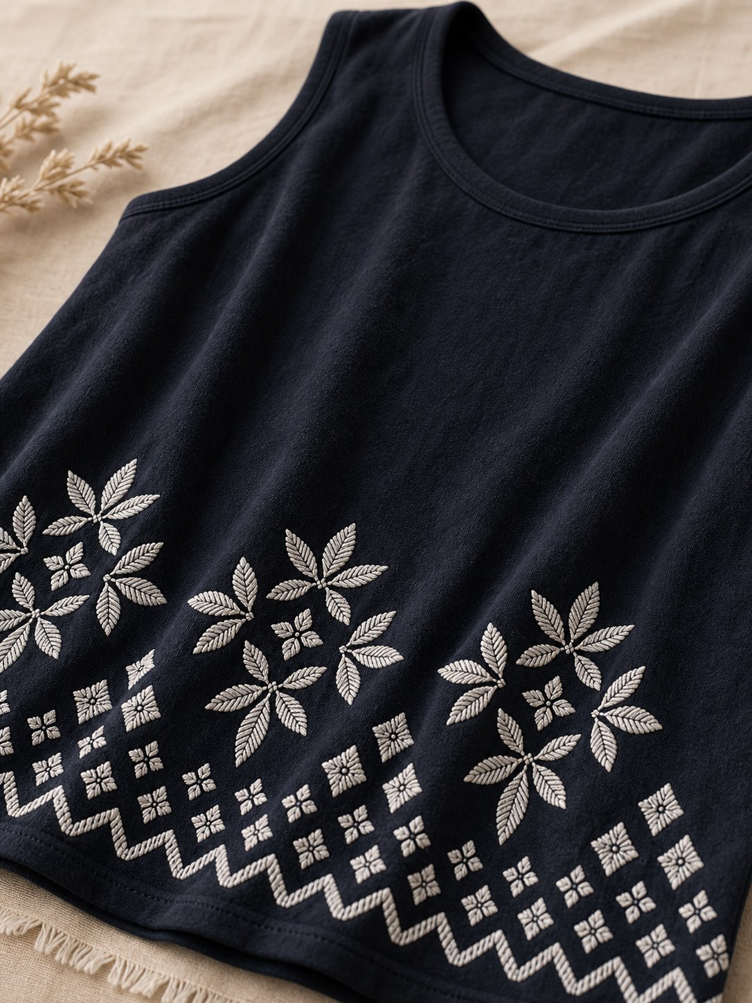 Close-up detail of embroidered lower border and soft fabric
