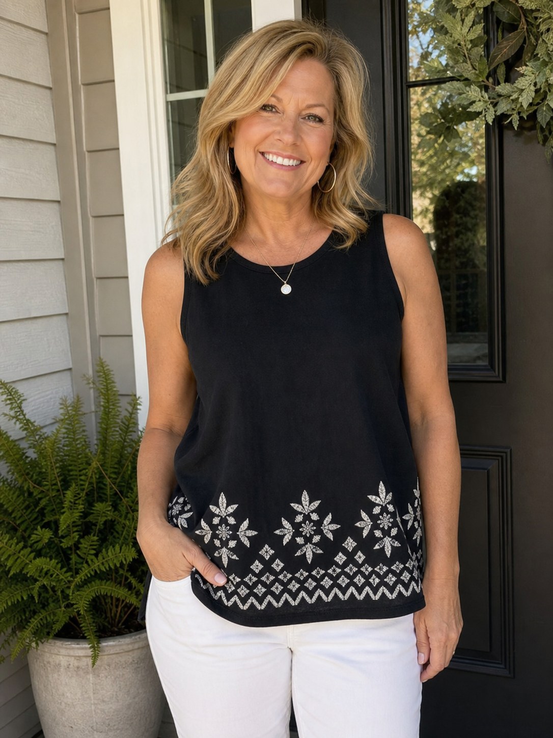 Customer wearing black embroidered border sleeveless tank top