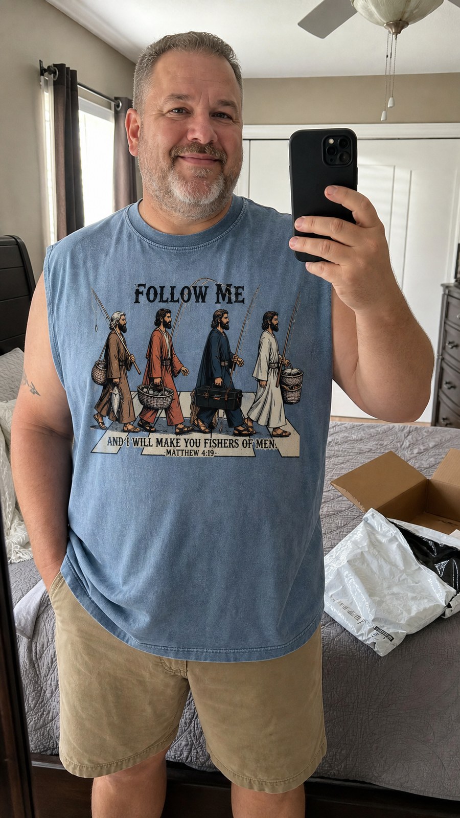 Buyer mirror try-on photo wearing washed denim sleeveless tee