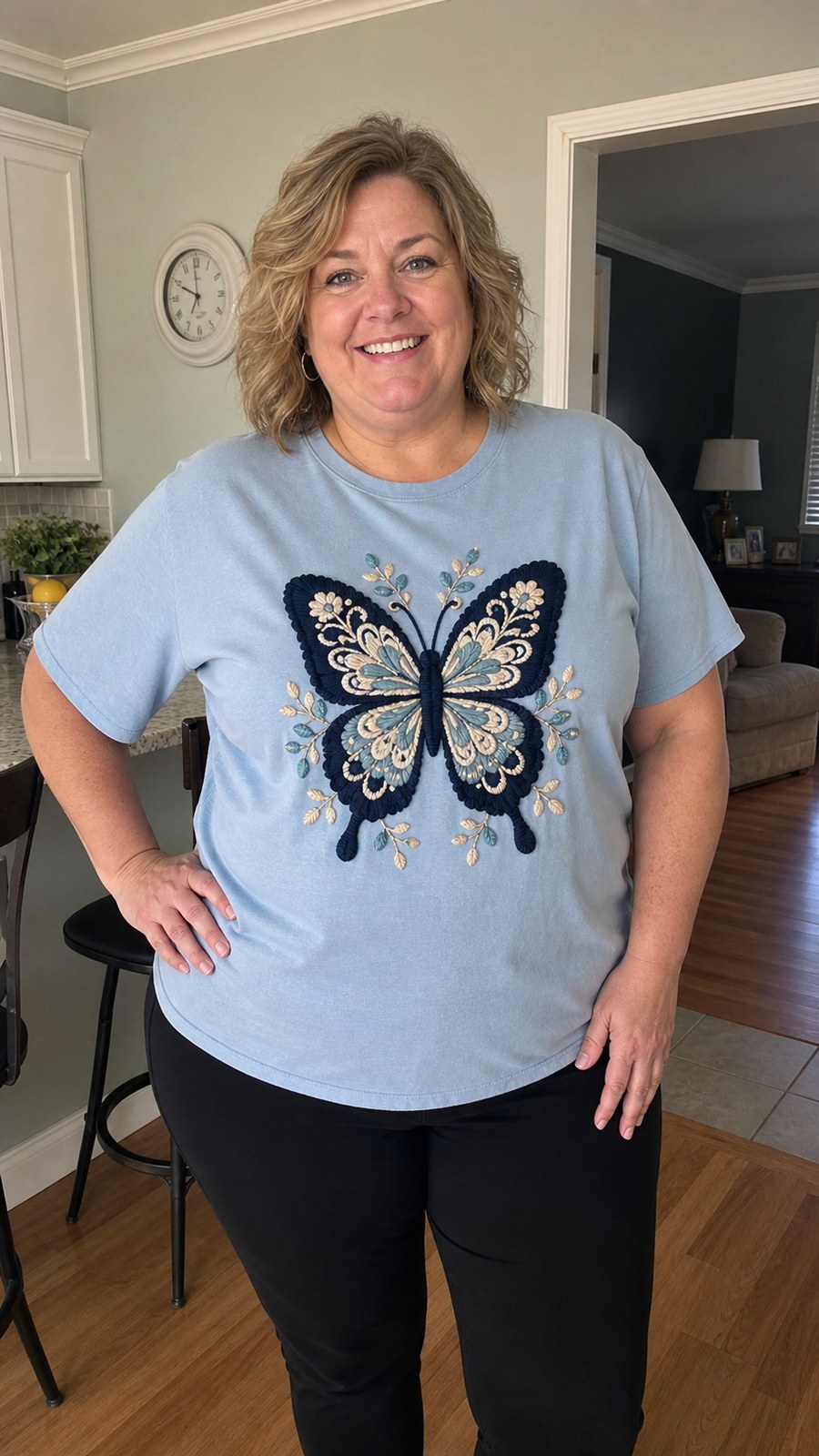 Customer wearing dusty blue crochet butterfly graphic tee