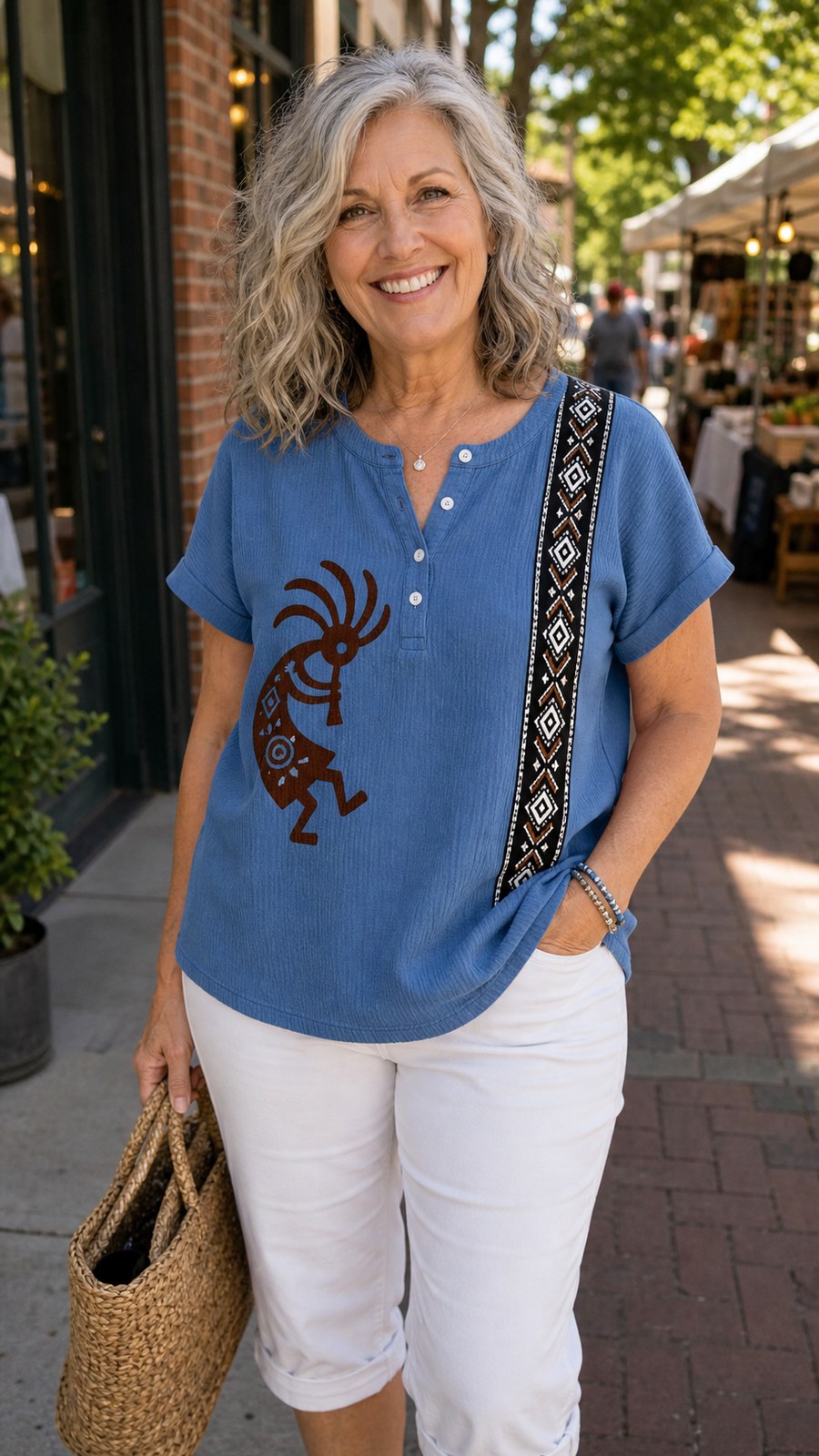 Customer wearing denim blue Southwest Kokopelli henley top