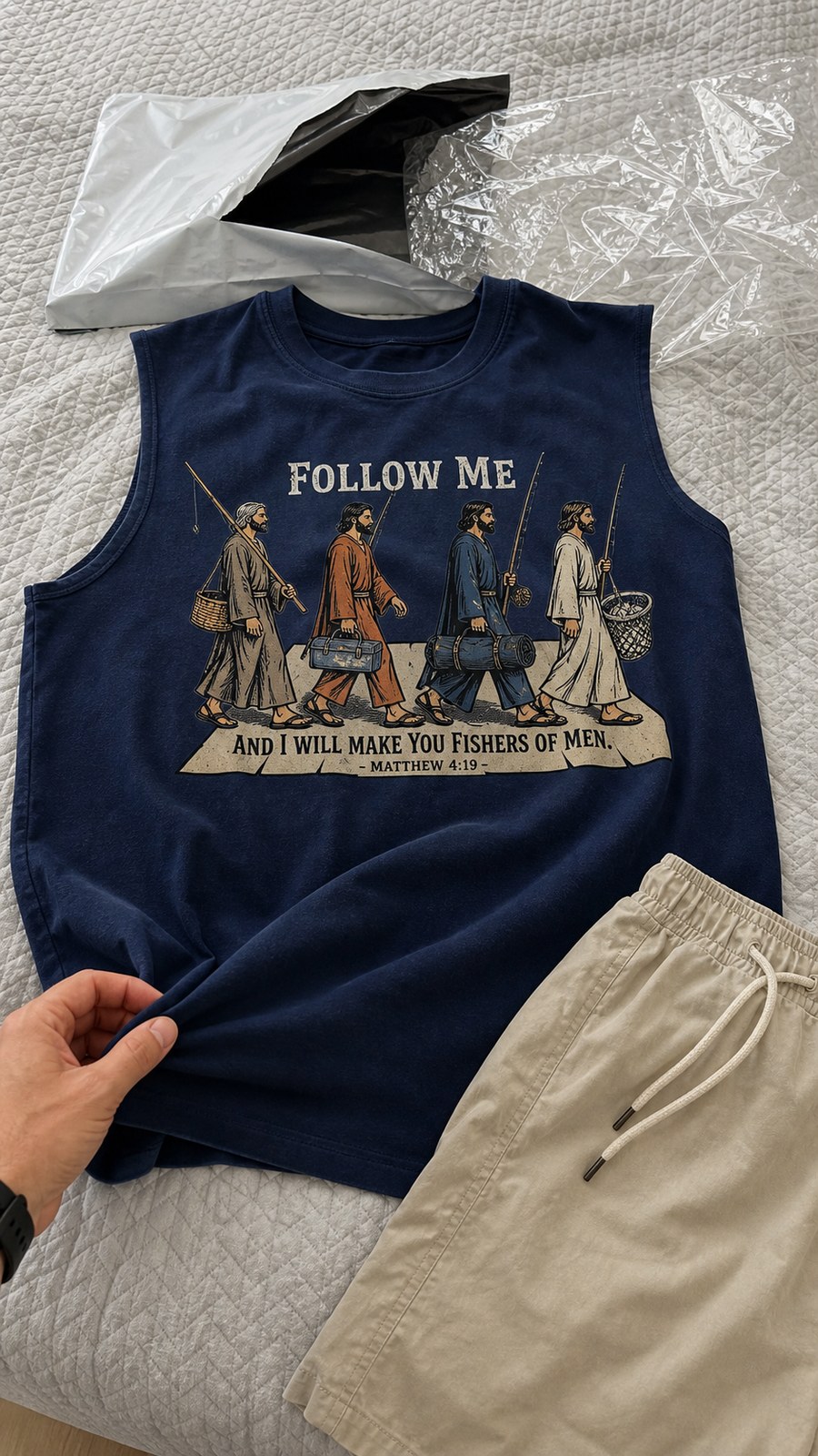 Buyer arrival photo of navy sleeveless tee on bed with packaging