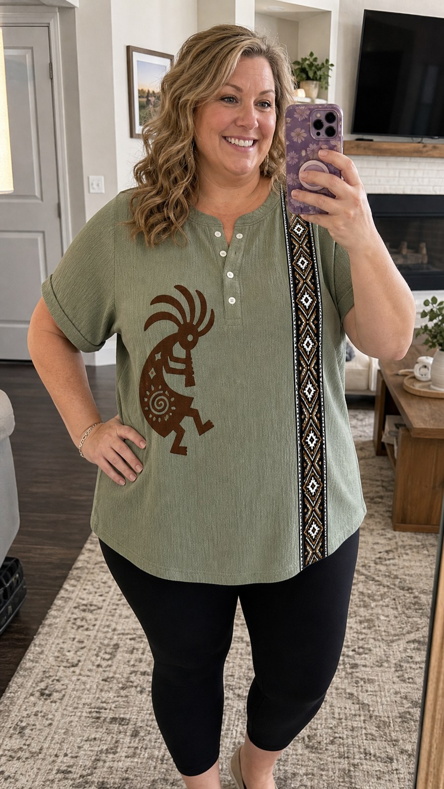 Plus-size customer wearing sage Southwest Kokopelli henley top