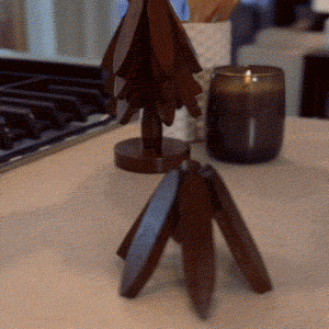Christmas tree wooden coaster set being demonstrated