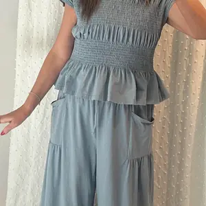 Source customer photo of Dusty Blue smocked set for final page
