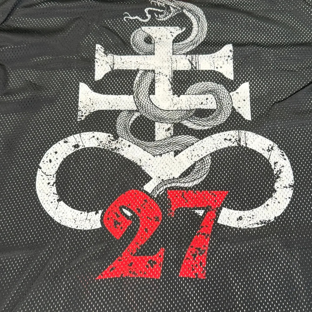 Real Mesh Jersey sample close-up showing micro-perforations through the back print