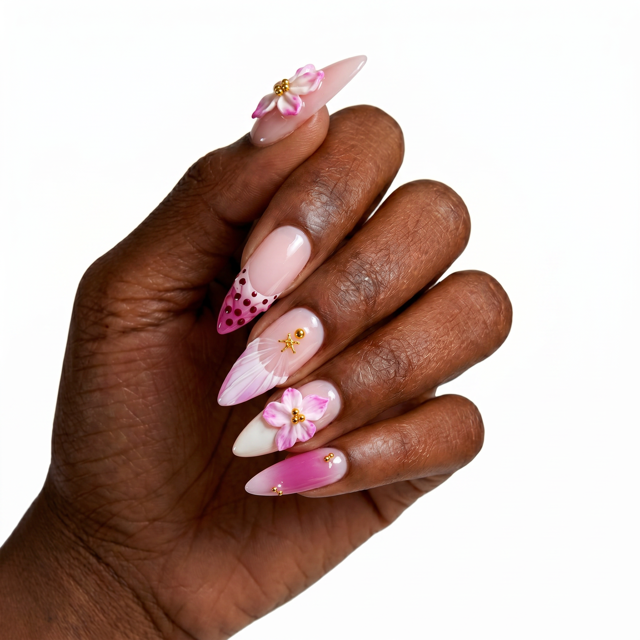 High-gloss romantic press-on nails featuring 3D sculpted pink flowers, white shell ripples, gold starfish accents, and pink gems.