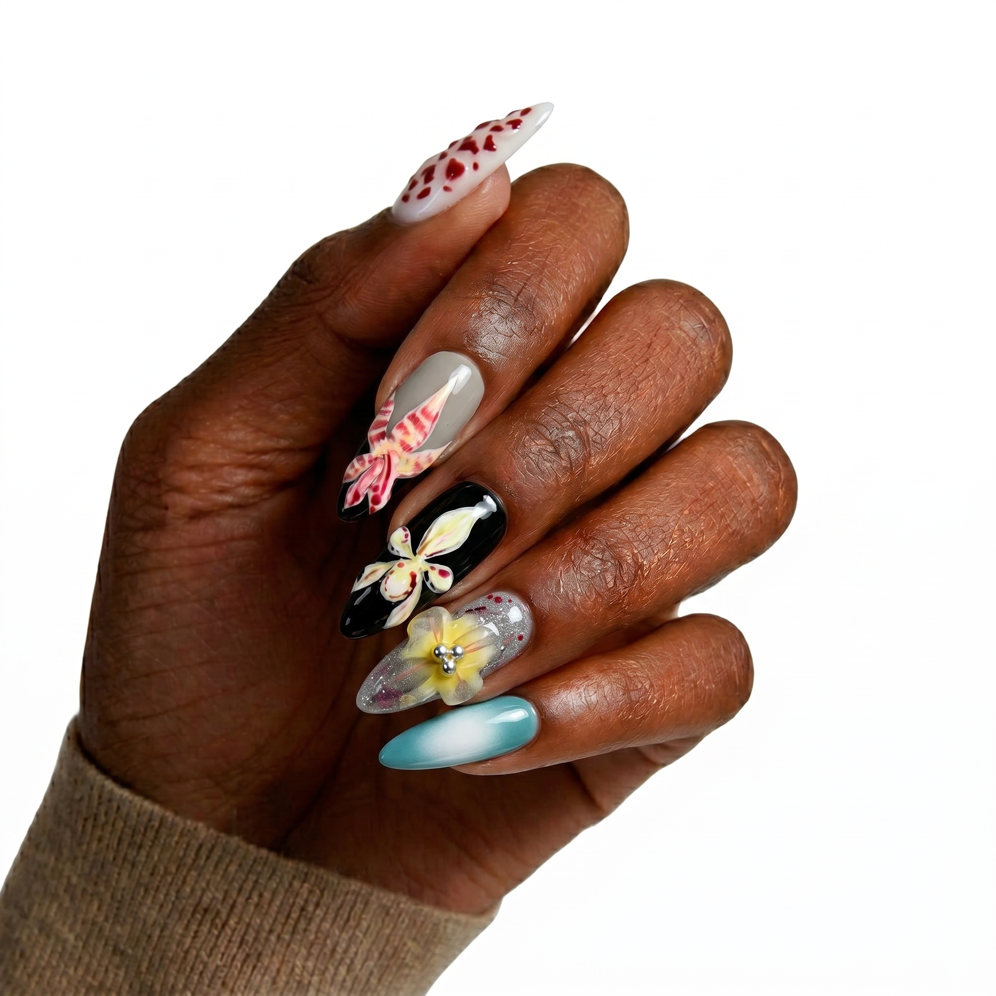 High-gloss multi-design press-on nails featuring hand-painted orchids, a 3D flower with a pink pearl center, moss green watercolor, and 3D dewdrops.