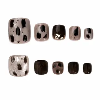 Chic animal print press-on toe nails with spotted pattern on a neutral base