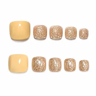 Glossy press-on toenails featuring a warm vanilla cream base and mismatched silver foil shimmer accents on smaller toes.