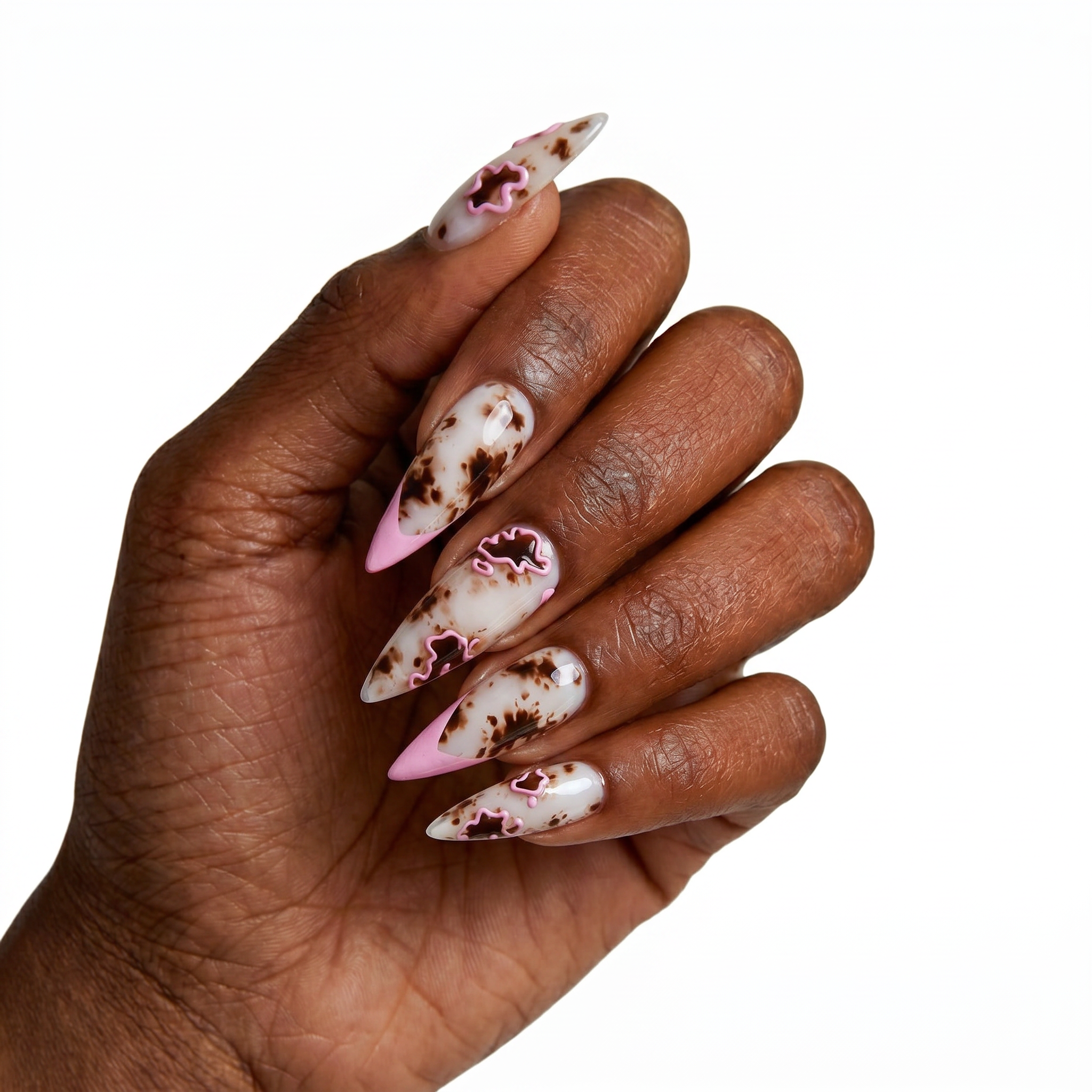Pointed stiletto press-on nails featuring a brown and cream tortoise shell pattern outlined with 3D raised pink fluid lines.