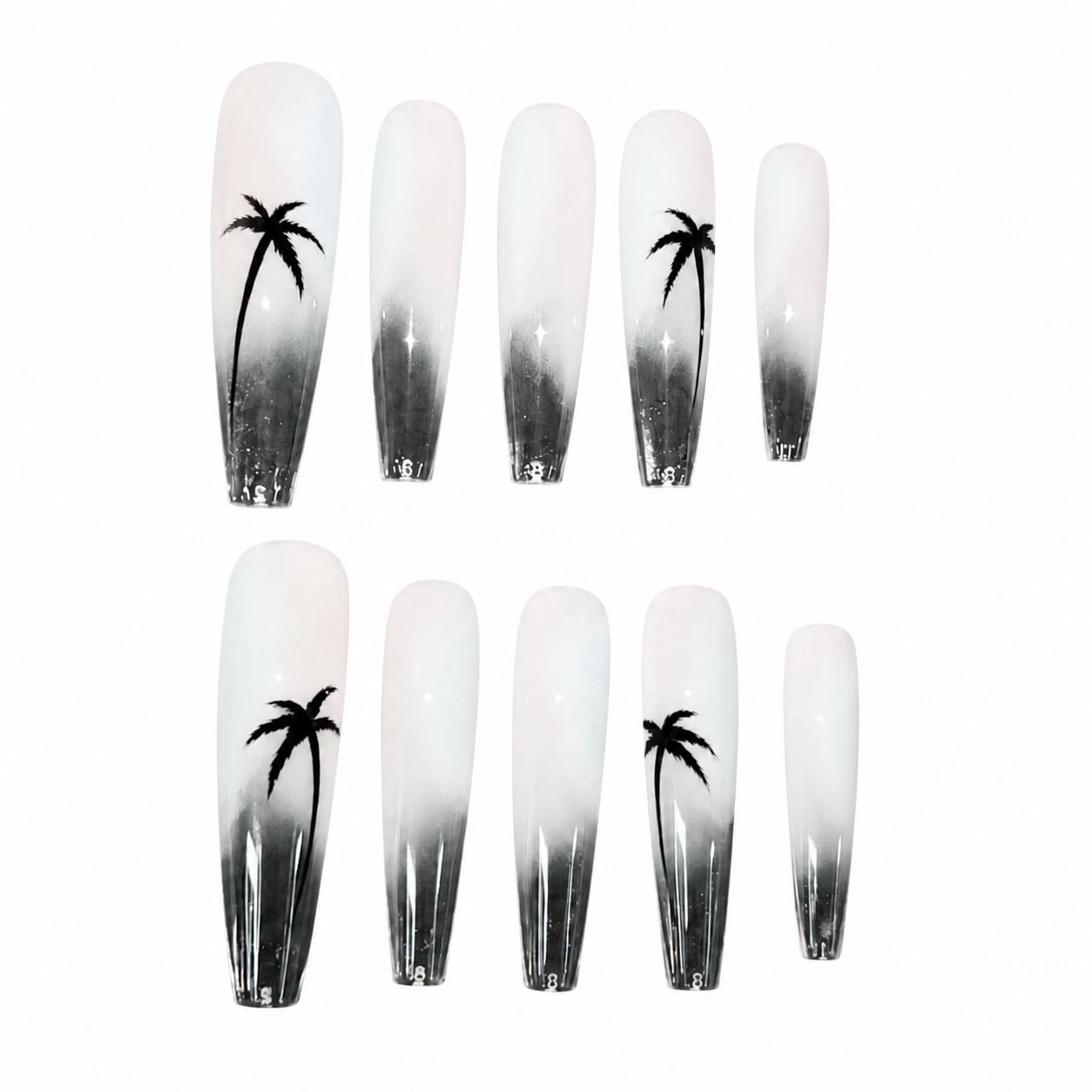 Glossy press-on nails with a misty white to translucent black gradient background, featuring hand-painted palm tree silhouettes.