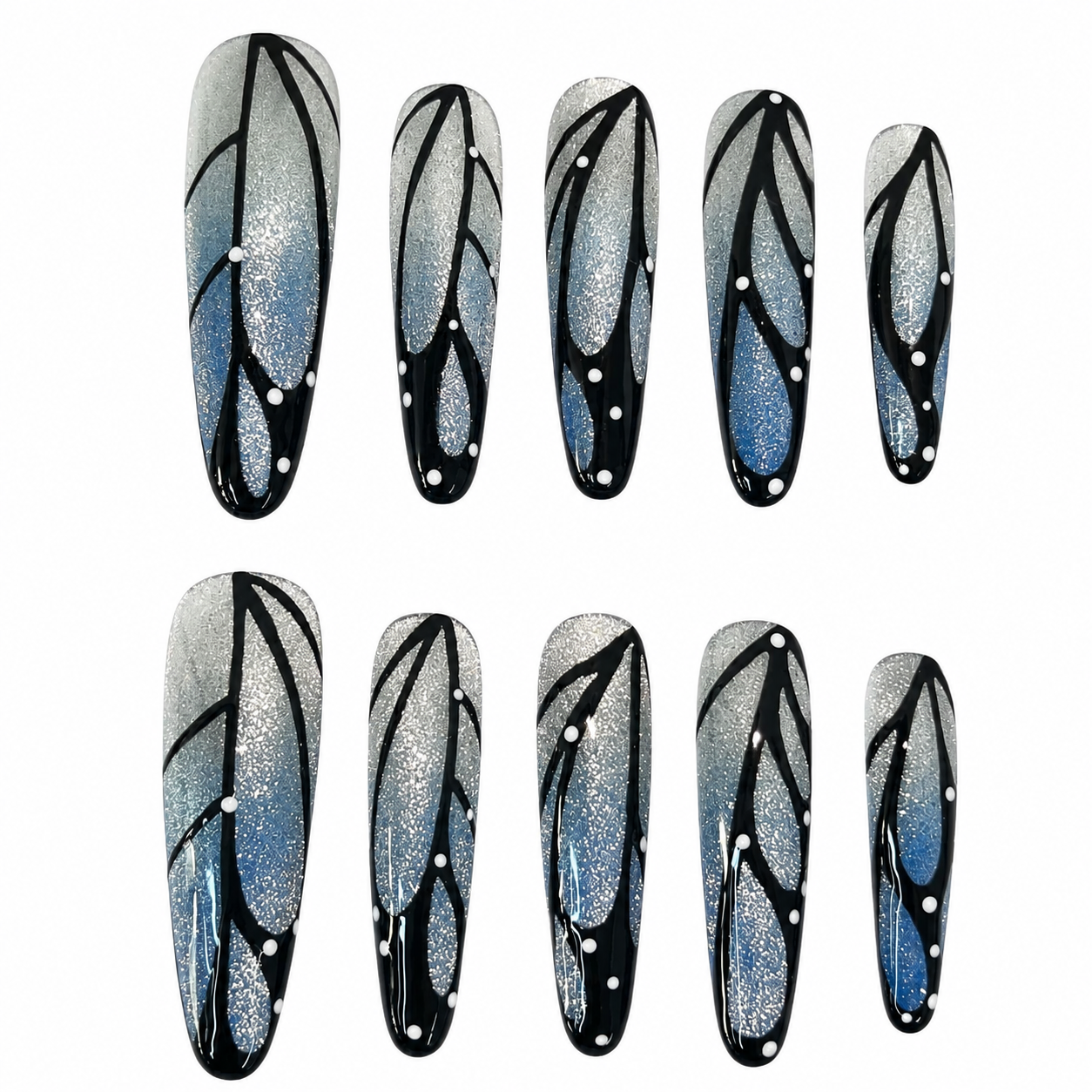 Glossy press-on nails with a silver glitter to ocean blue gradient base, featuring hand-painted black butterfly wings and white dot details.