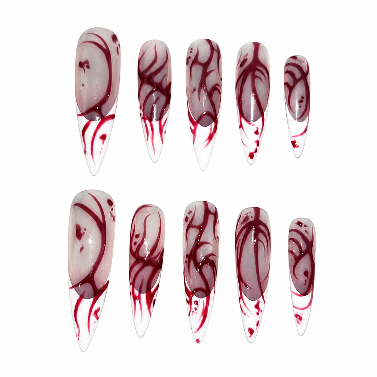 Glossy press-on nails with a clear base, featuring hand-painted crimson cyber-tribal lines and bleeding abstract French tips.