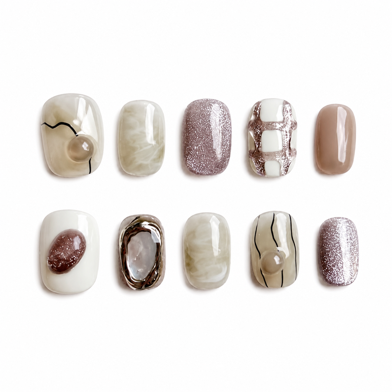 Glossy press-on nails featuring a mix of mineral jade smudges, mauve cat-eye glitter, hand-painted geometric lines, and round 3D pebble charms.