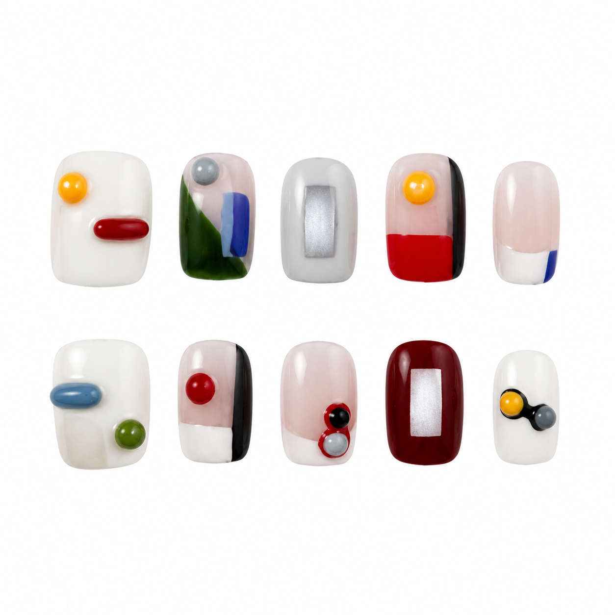 Glossy press-on nails featuring an abstract geometric Mondrian design with hand-painted colorful blocks, metallic silver squares, and 3D capsule accents.