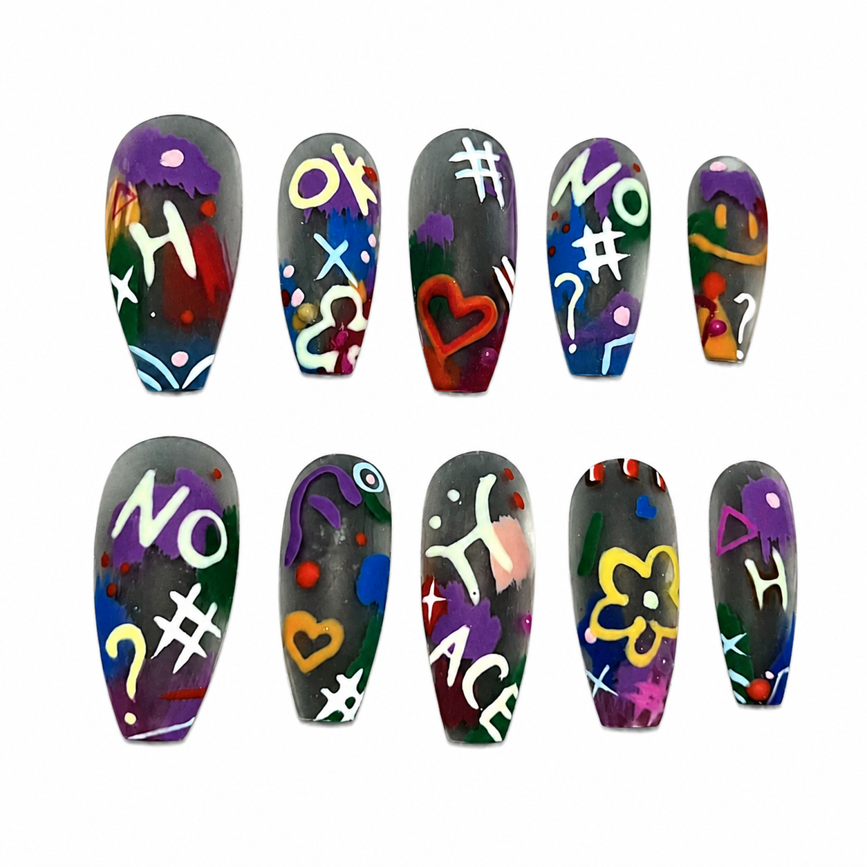 Glossy press-on nails featuring a smoky translucent black base decorated with colorful hand-painted street graffiti, words like "NO" and "ACE", and neon symbols.