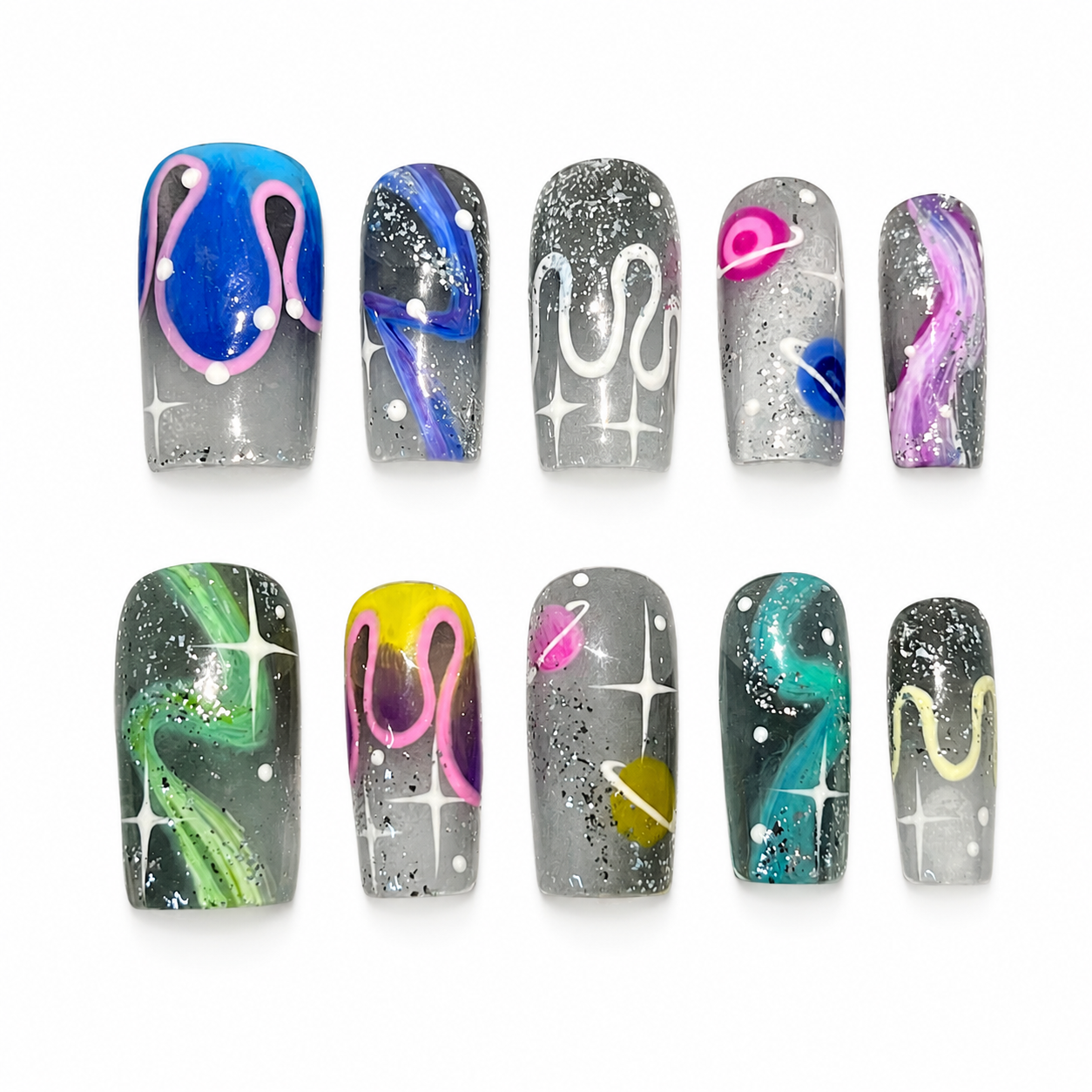 Glossy press-on nails with a smoky grey glitter base, hand-painted colorful cosmic nebulae, white starbursts, and neon 3D wavy fluid lines.