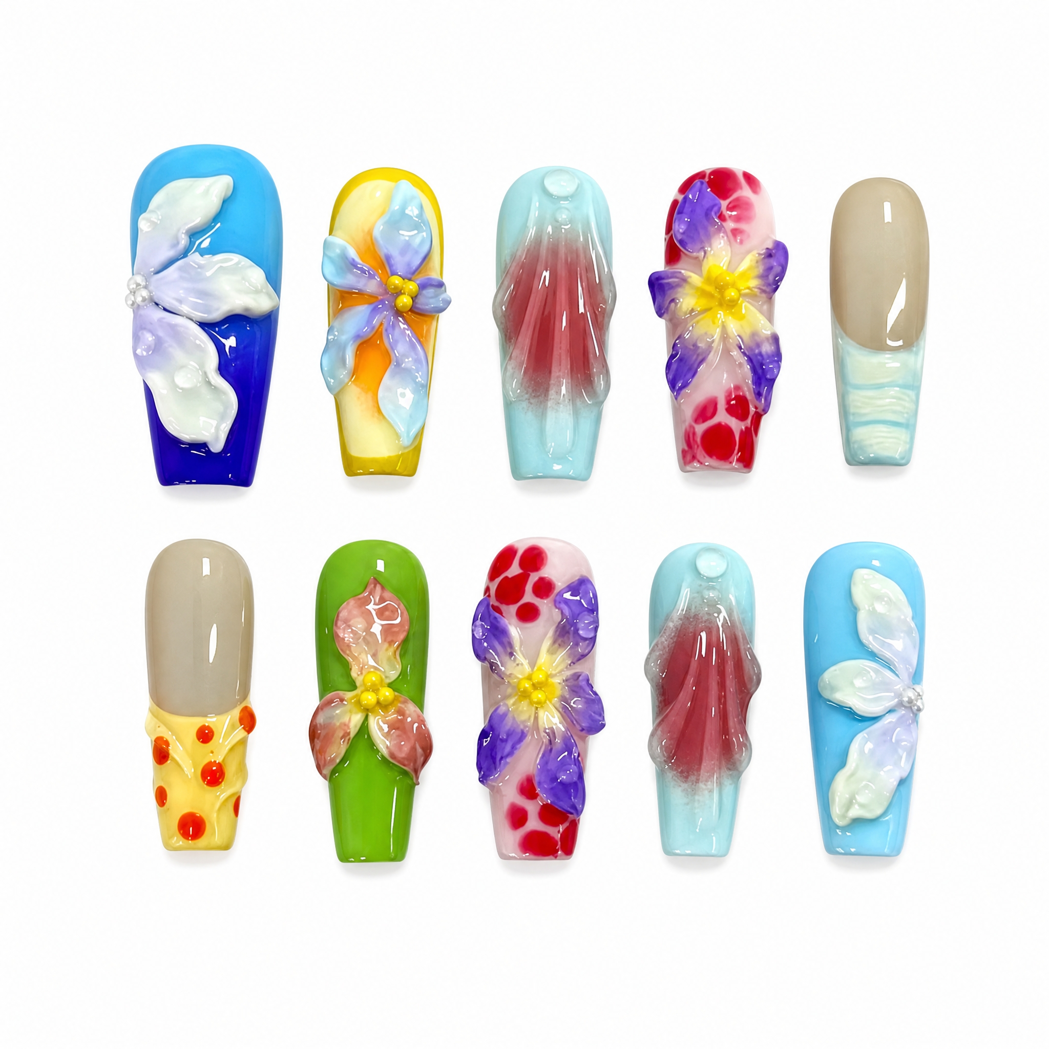 High-gloss multi-colored press-on nails with 3D sculpted white and purple flowers, colorful watercolor washes, and polka-dot patterns.