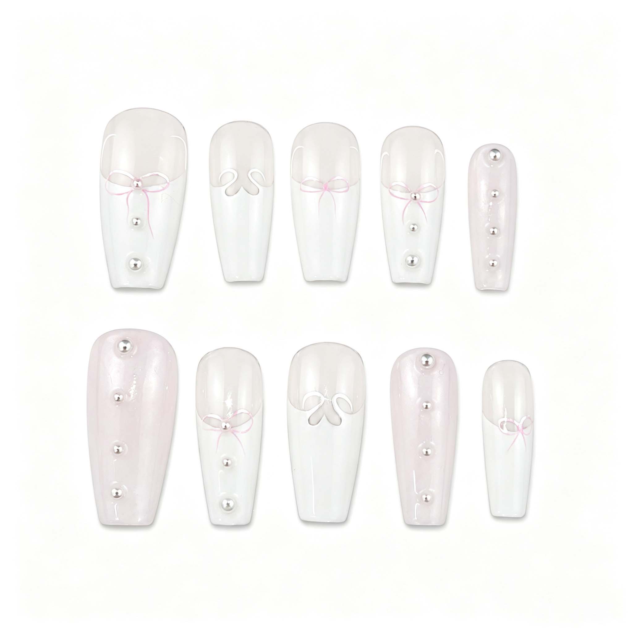 Glossy coffin press-on nails with a milky white base, porcelain French tips, hand-painted pink ribbons, 3D liquid silver bows, and elegant pearl details.