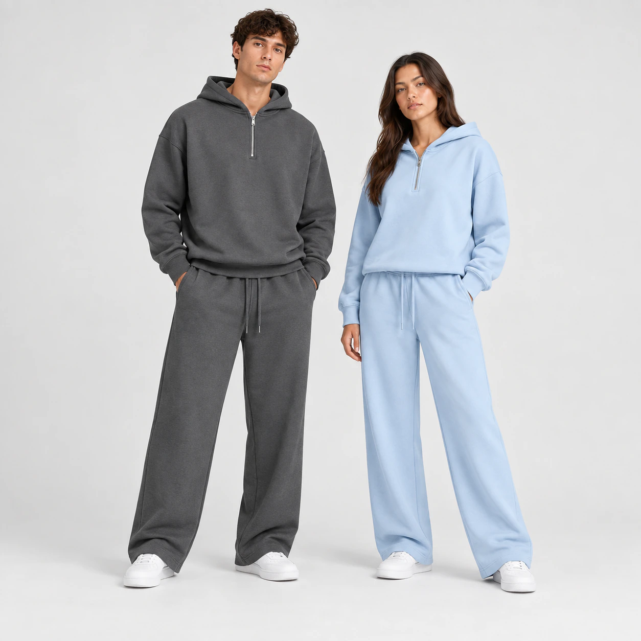 Front view of two models wearing Dark Gray and Light Blue half-zip hoodie and straight-leg sweatpants sets.