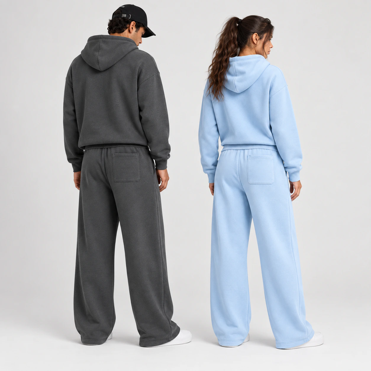 Rear view of two models showing the confirmed single rear patch-pocket placement on the straight-leg sweatpants.