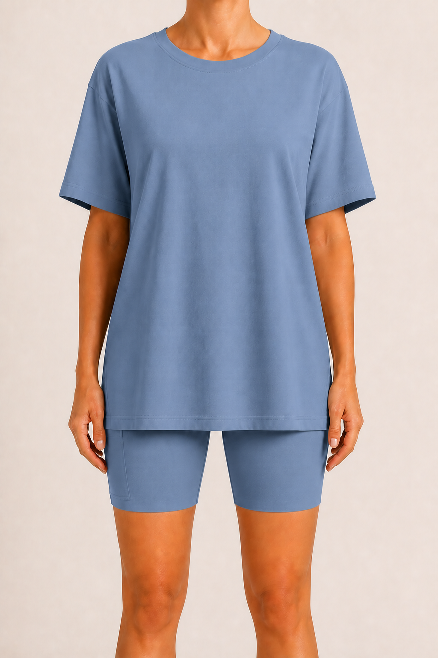 Large straight front view with the oversized tee hem fully lowered and one wearer-right pocket on image left