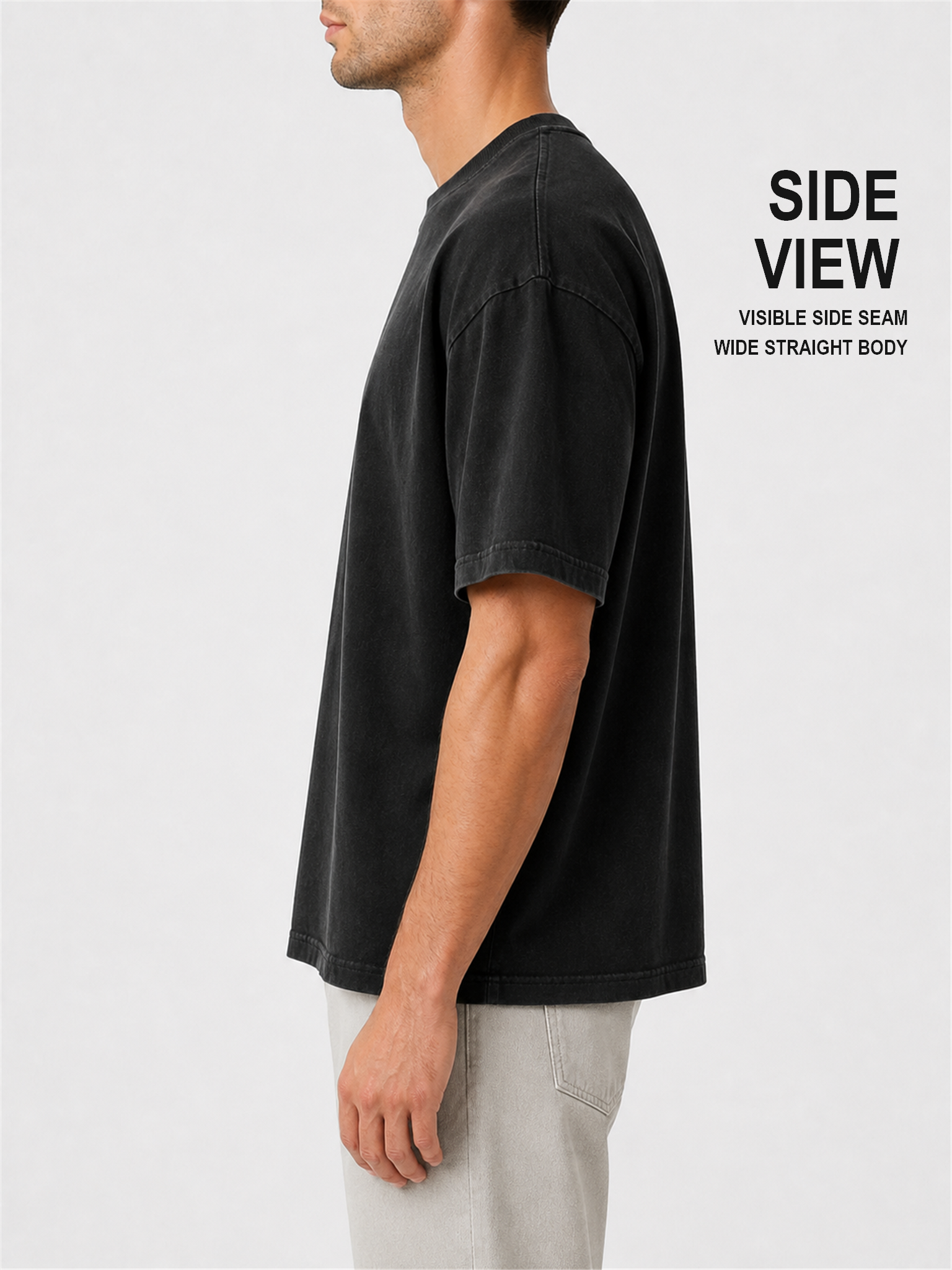 Male model side view showing the visible side seam and wide straight T-shirt body