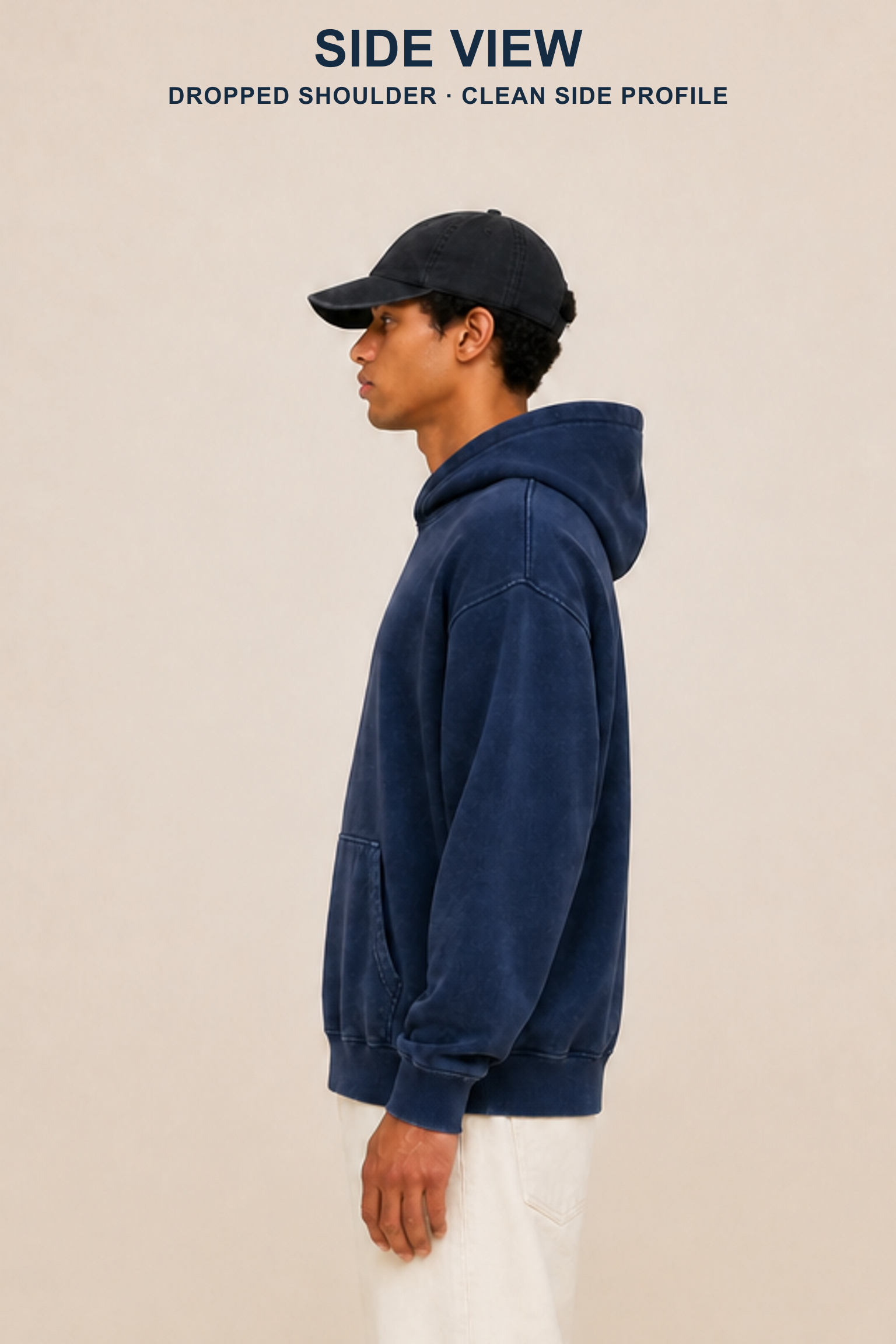Large complete-head true side view of an adult model wearing the Navy washed pullover hoodie