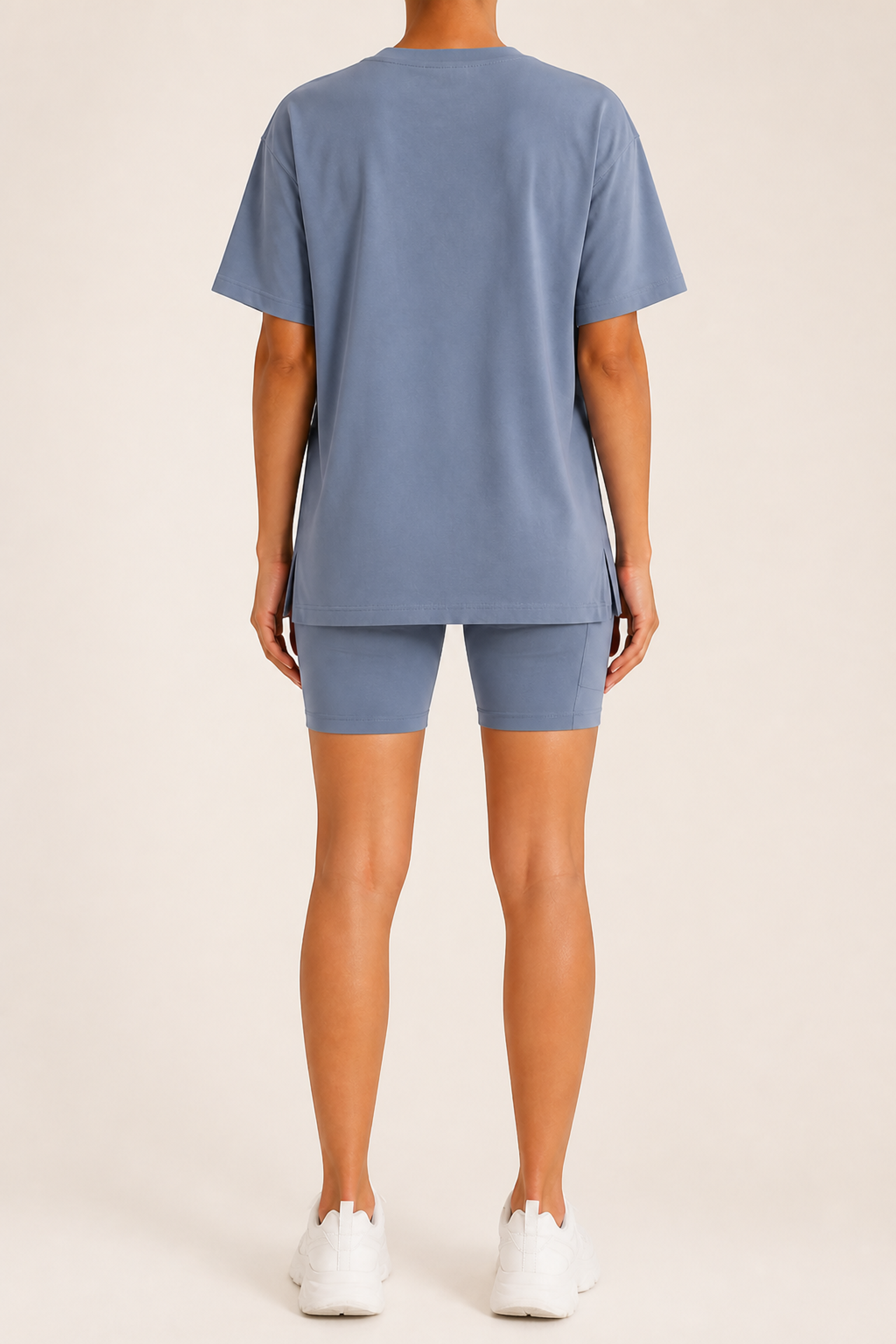Large back view showing a plain shorts back and equal-length tee hem