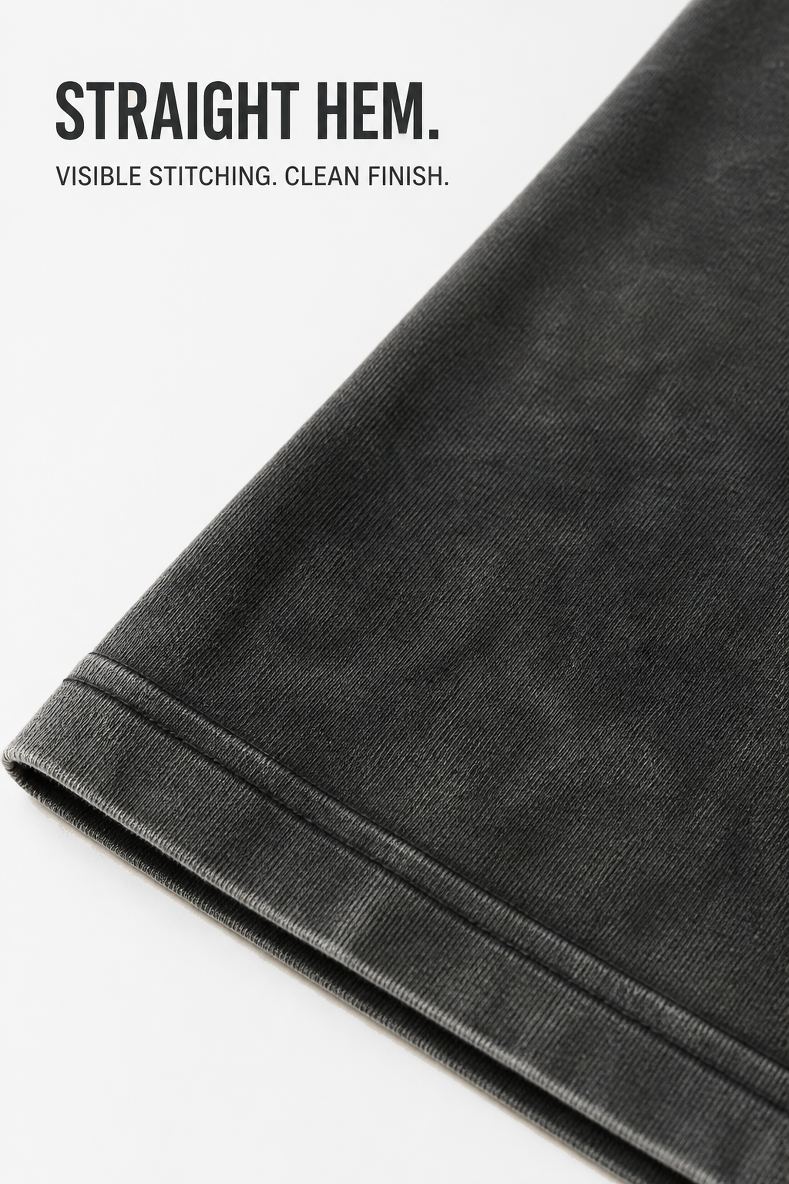 Large close-up of the straight bottom hem and visible stitching