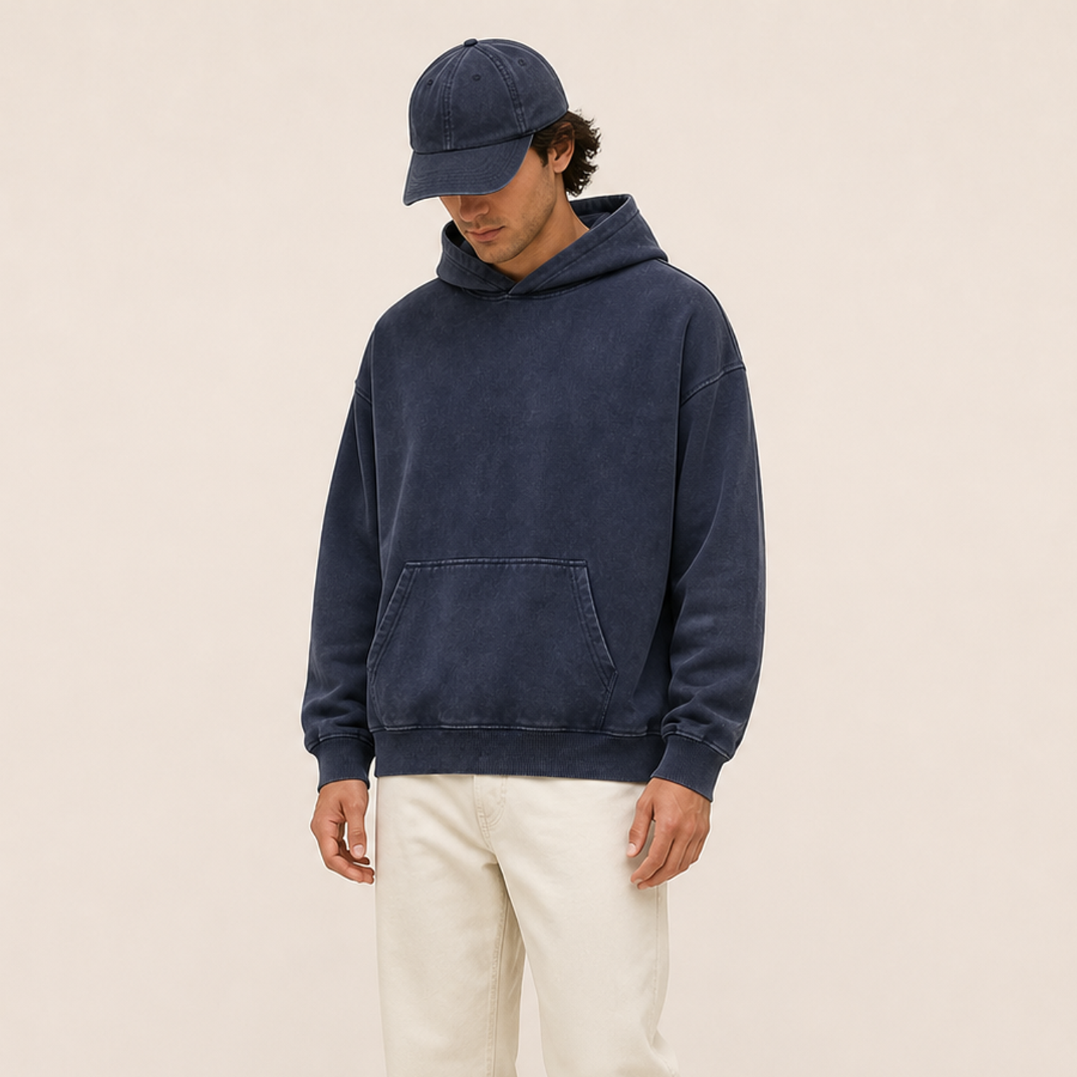 Adult model wearing the Navy vintage wash pullover hoodie in front view