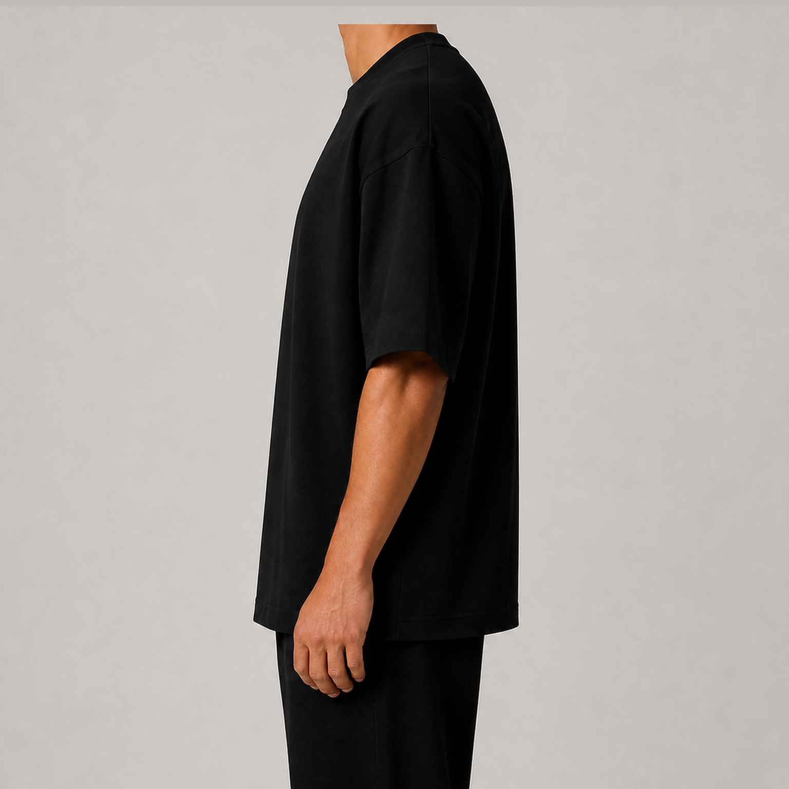Full side view of men's black 7.5oz heavyweight oversized T-shirt without model face
