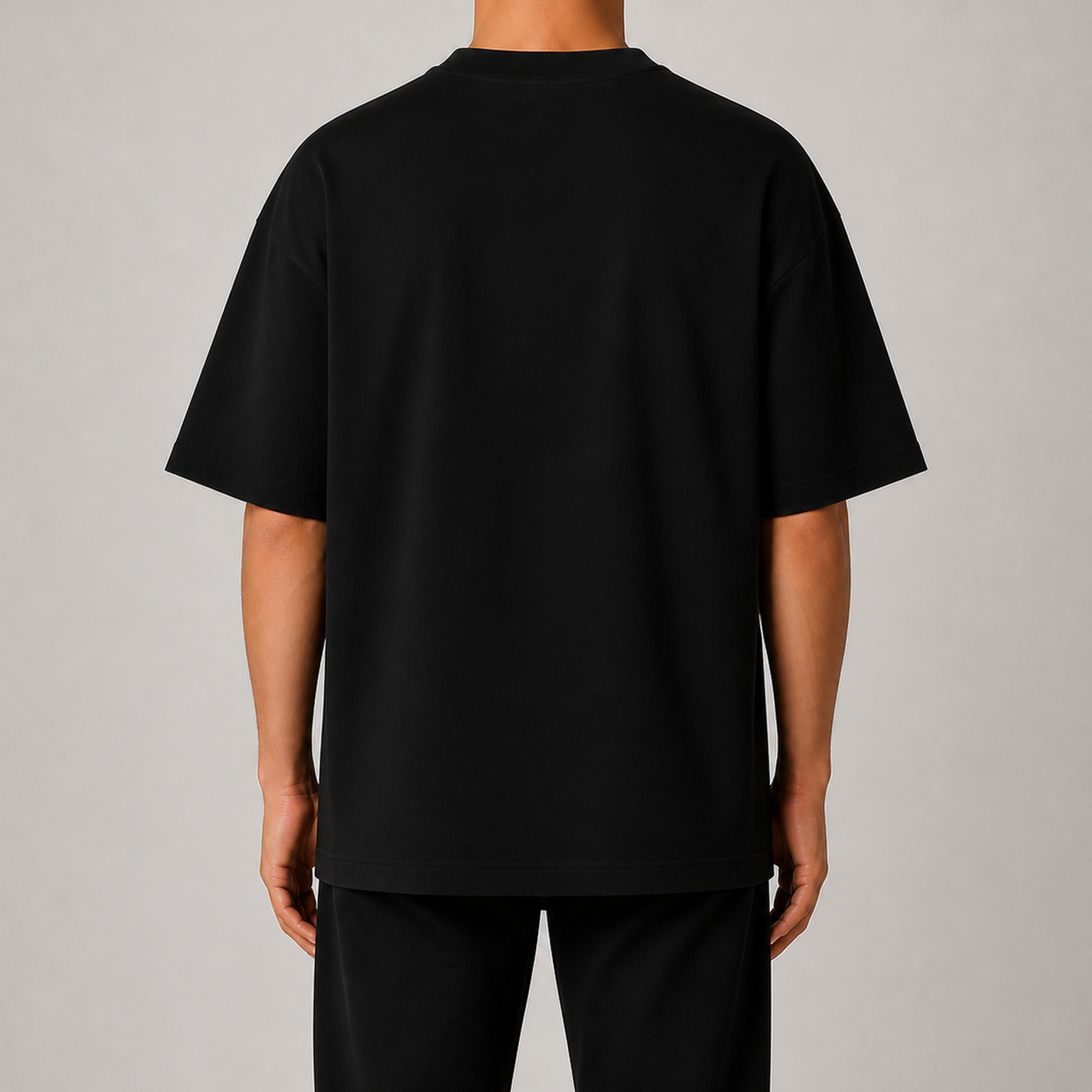 Full back view of men's black 7.5oz heavyweight oversized T-shirt without model face