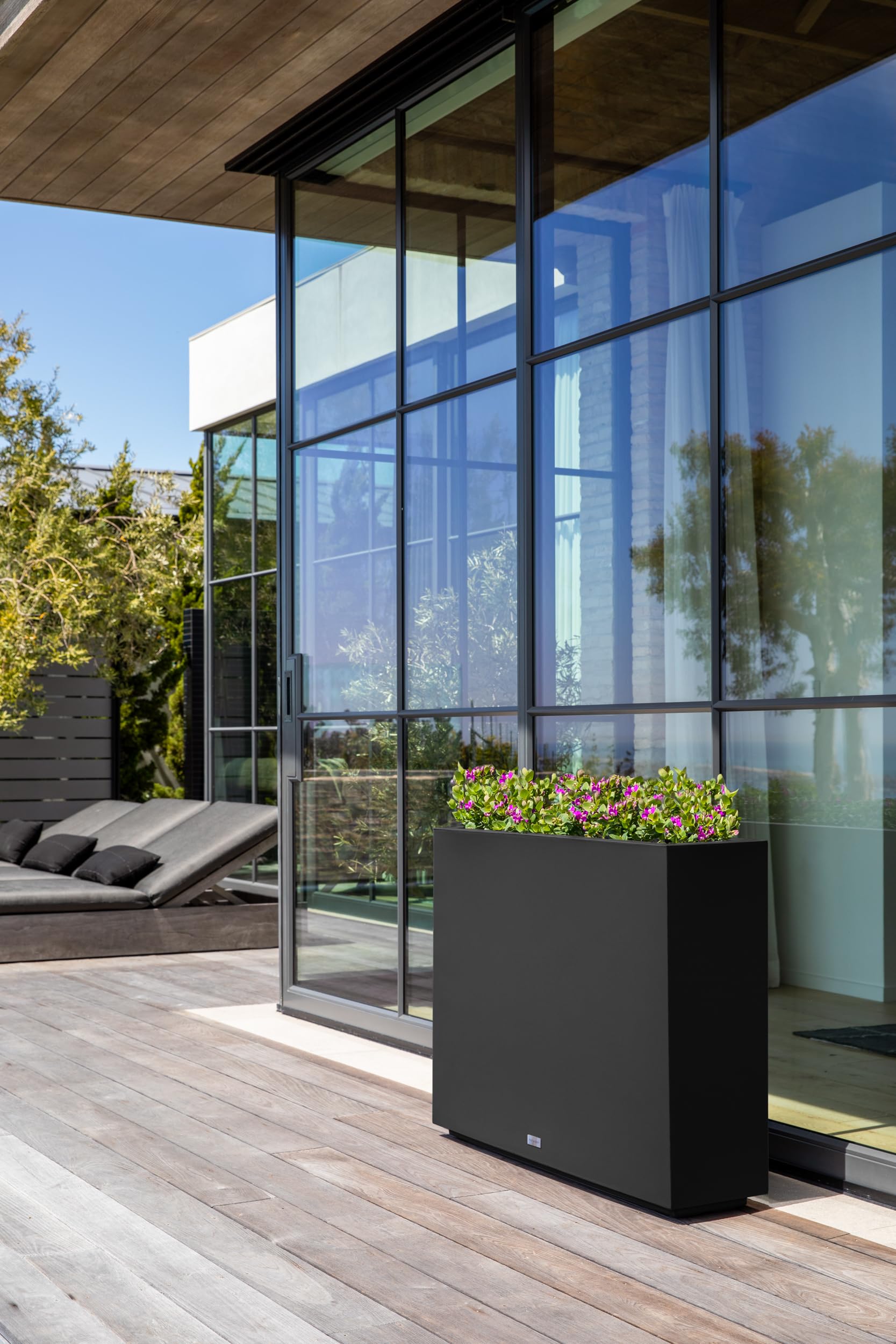 Beautiful privacy screen with cedar trees & planters lit up at night with solar lights-Aldronix