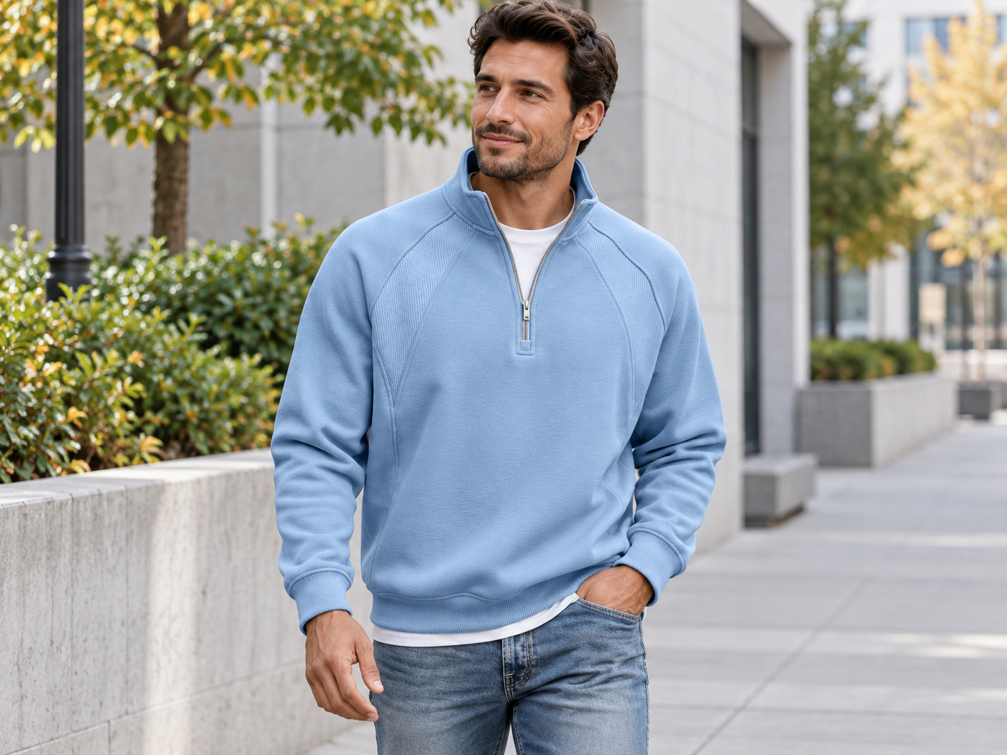 Man styling the light blue half-zip stand-collar sweatshirt