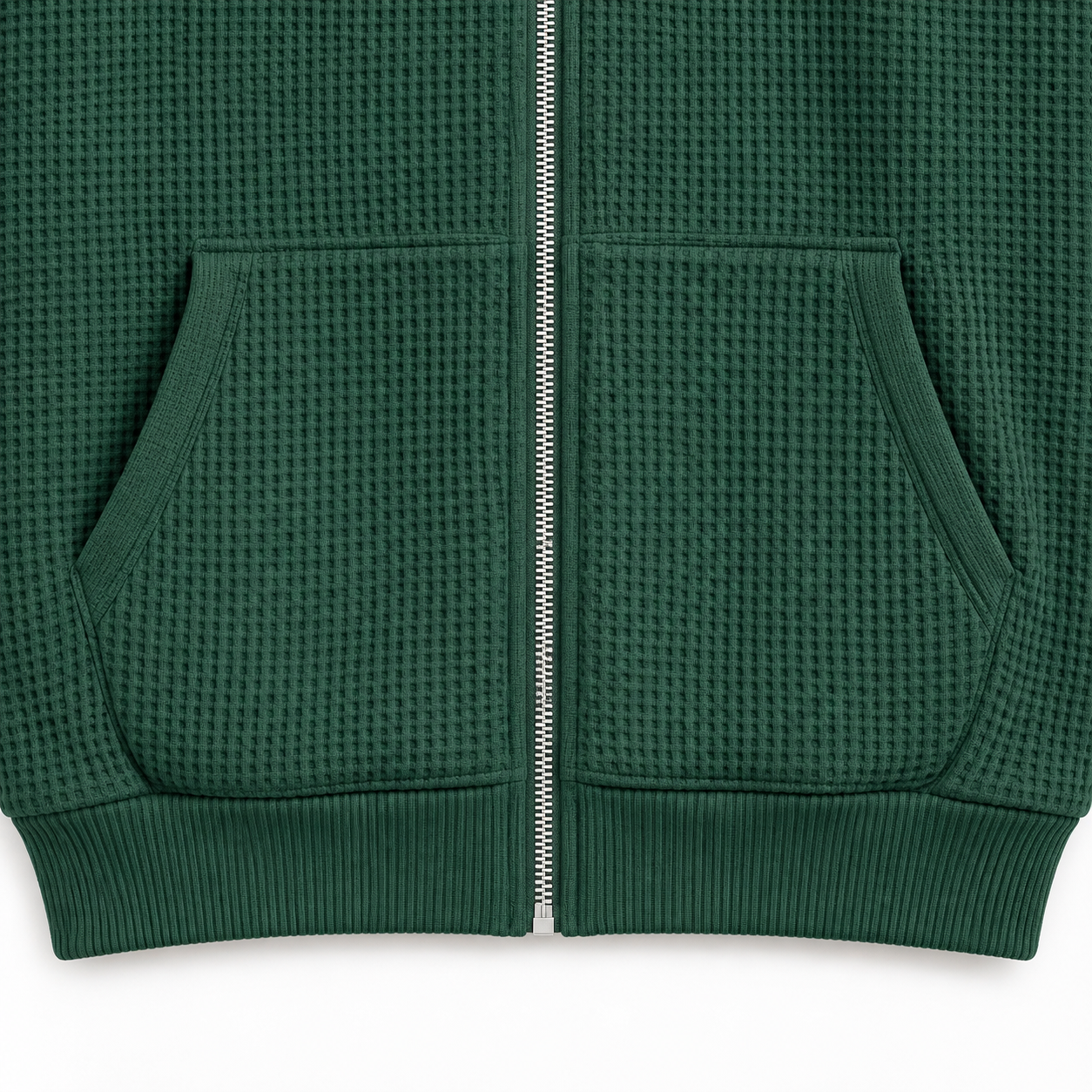 Close-up of the front patch pockets and ribbed hem