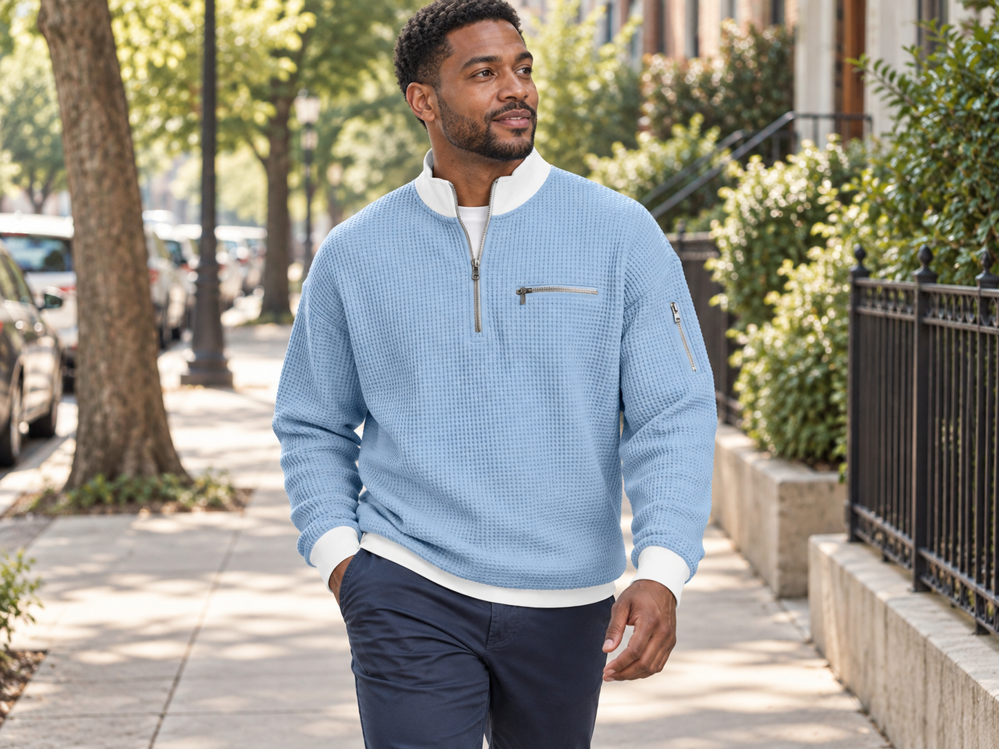 Man wearing the blue zip-up sports sweatshirt on a neighborhood walk