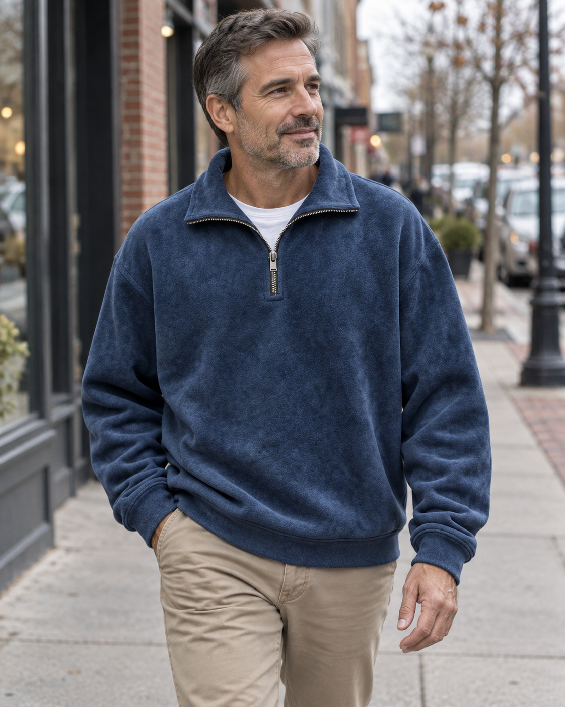 Navy half-zip sweatshirt worn on a city walk