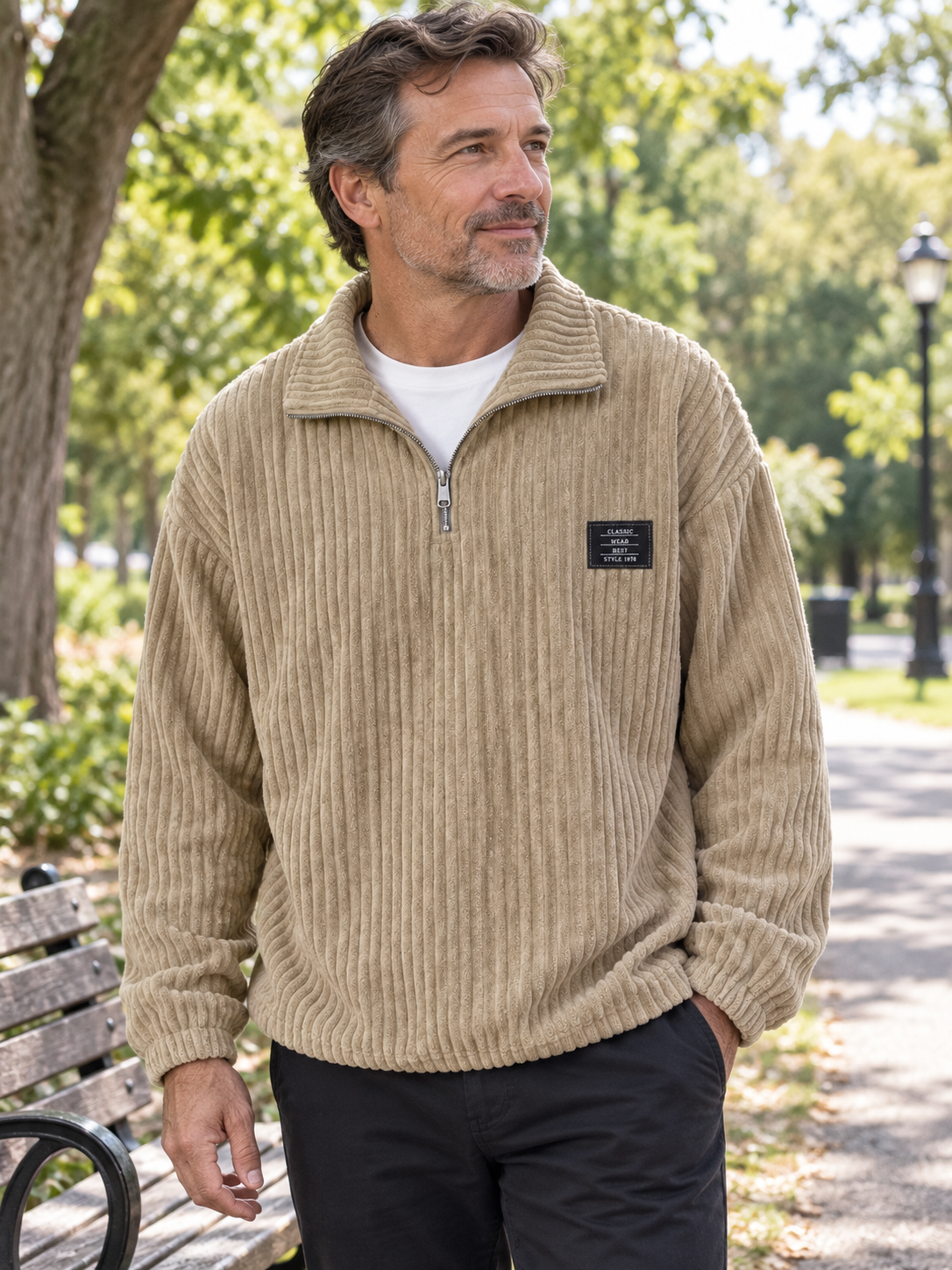 Man wearing the khaki corduroy half-zip sweatshirt in a park