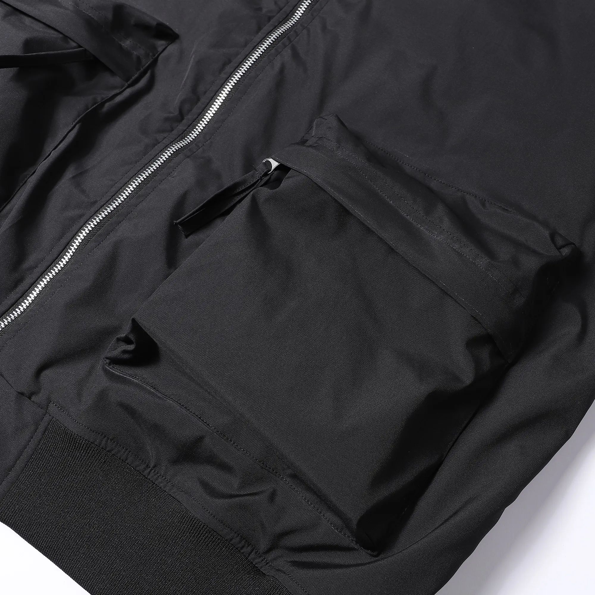 Plus-size men’s workwear jacket featuring a relaxed fit with multiple zippered pockets