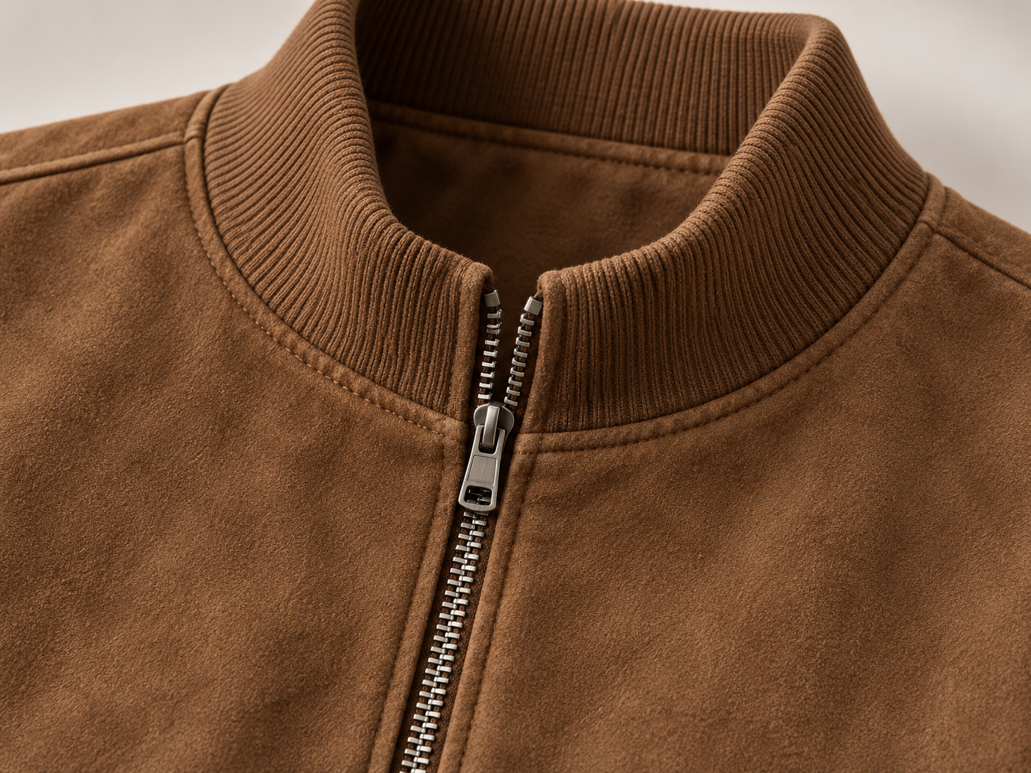 Close-up illustration of the ribbed stand collar and full front zipper