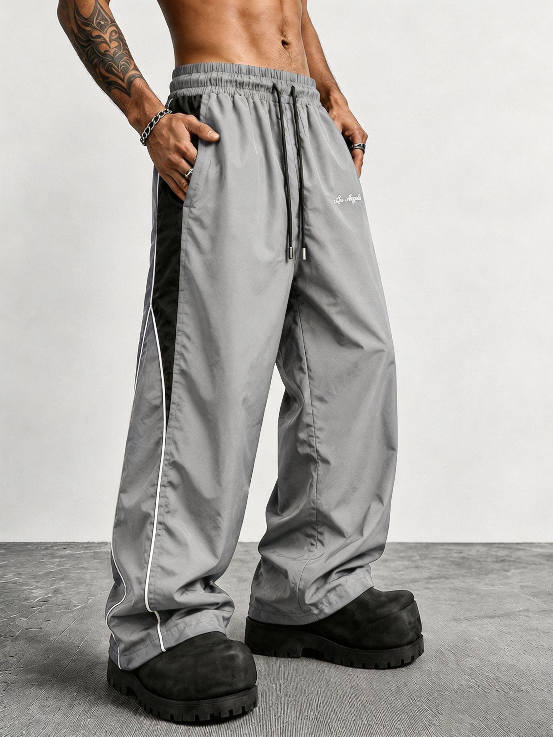 Men's contrasting color reflective strip wide-leg casual pants, pendant smooth fabric, side stripes, American high street style, daily commuting adaptation, trendy and versatile personality