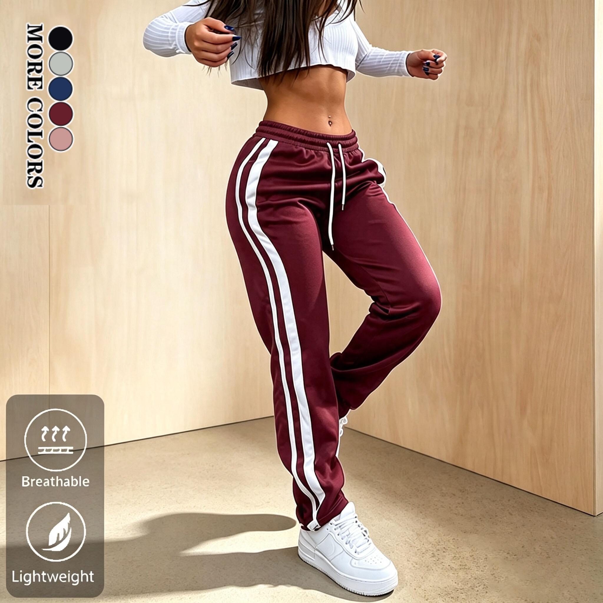 Women’s all-season new side-striped athletic pants—sweet‑cool sporty style with a drawstring elastic waistband; casual pants suitable for fitness, everyday wear, going out, and campus outfits. Women’s all-season new side-striped athletic pants—sweet‑cool sporty style with a drawstring elastic waistband; casual pants suitable for fitness, everyday wear, going out, and campus outfits.