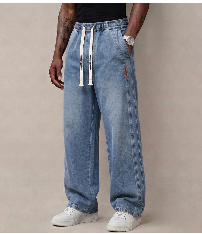 Men&rsquo;s jeans made from stretchy cotton&mdash;comfortable and stylish. Loose fit for everyday wear; long pants with a drawstring elastic waistband design for men.