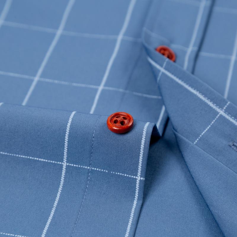 Men&rsquo;s short-sleeve shirt with four panels and color-block contrast collar, urban casual style. Turn-down collar with contrasting plaid lining, orange button front, and a slim fit. Smooth fabric drapes comfortably, with a tailored silhouette that flatters