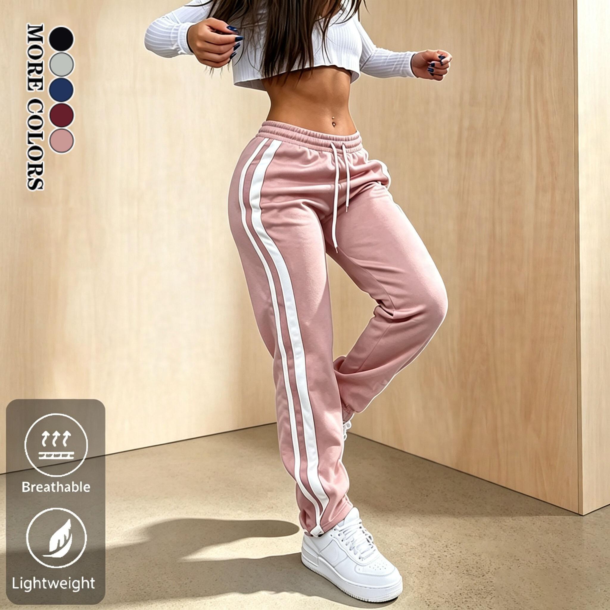 Women’s all-season new side-striped athletic pants—sweet‑cool sporty style with a drawstring elastic waistband; casual pants suitable for fitness, everyday wear, going out, and campus outfits. Women’s all-season new side-striped athletic pants—sweet‑cool sporty style with a drawstring elastic waistband; casual pants suitable for fitness, everyday wear, going out, and campus outfits.