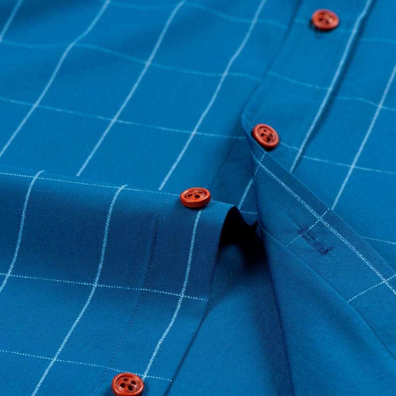 Men&rsquo;s short-sleeve shirt with four panels and color-block contrast collar, urban casual style. Turn-down collar with contrasting plaid lining, orange button front, and a slim fit. Smooth fabric drapes comfortably, with a tailored silhouette that flatters