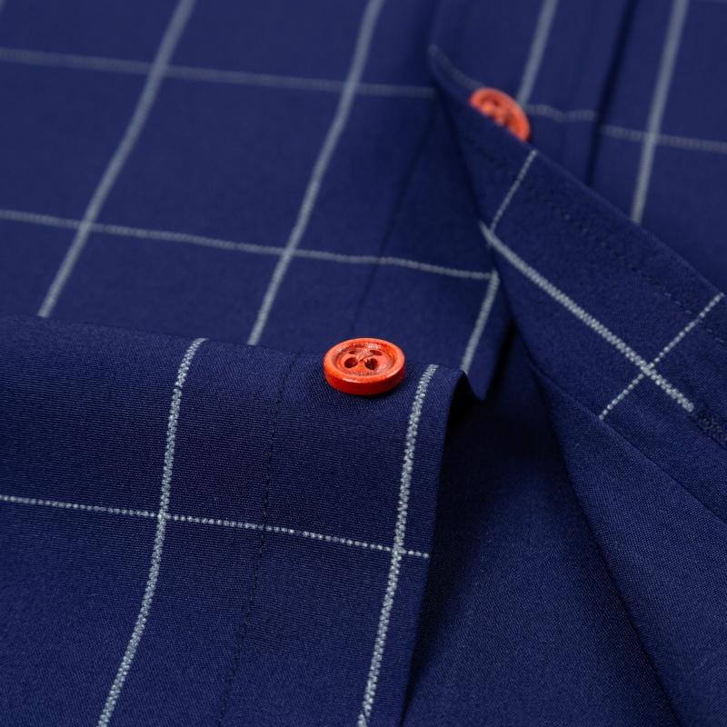 Men&rsquo;s short-sleeve shirt with four panels and color-block contrast collar, urban casual style. Turn-down collar with contrasting plaid lining, orange button front, and a slim fit. Smooth fabric drapes comfortably, with a tailored silhouette that flatters